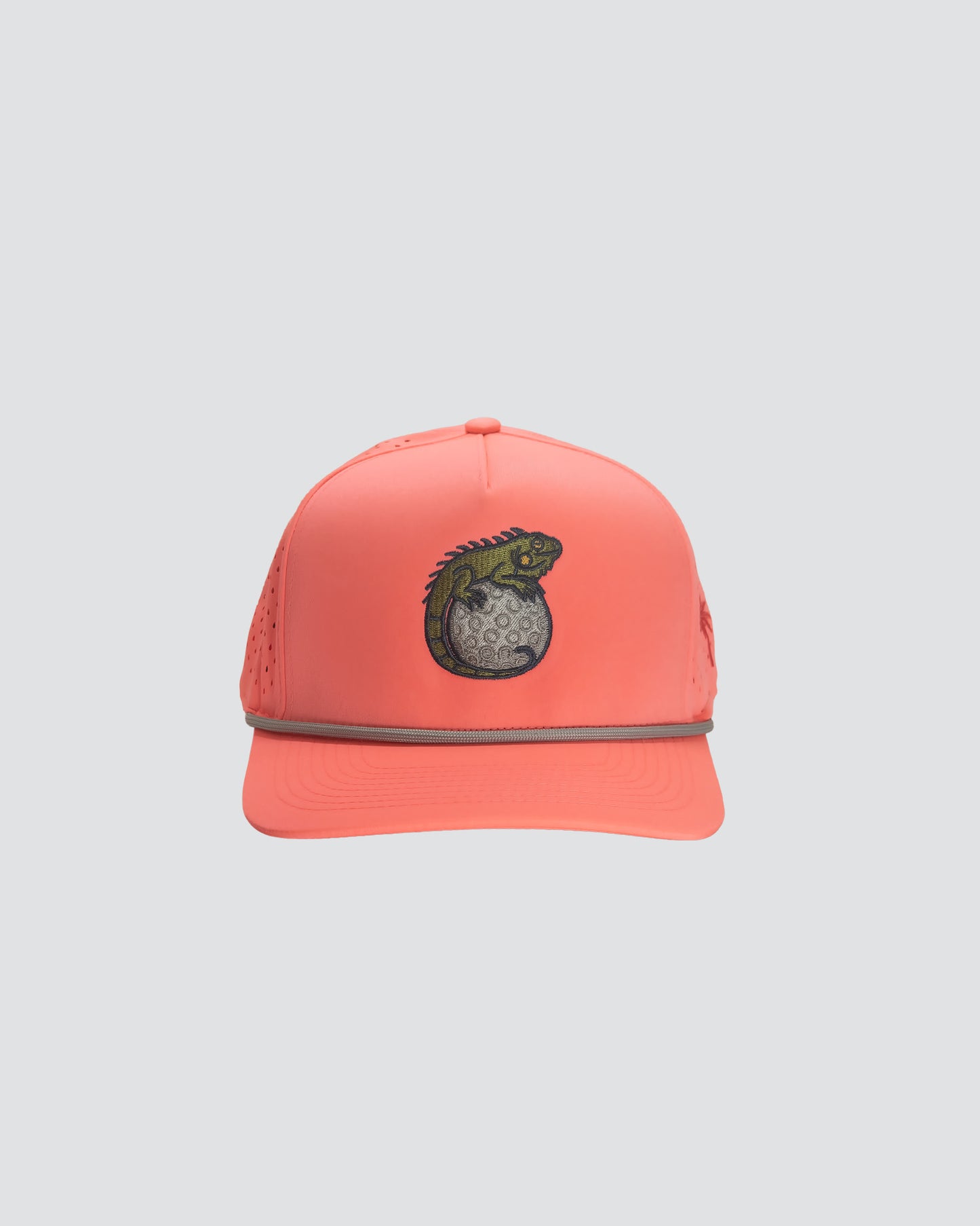 Coral cap with a lizard emblem on a white background